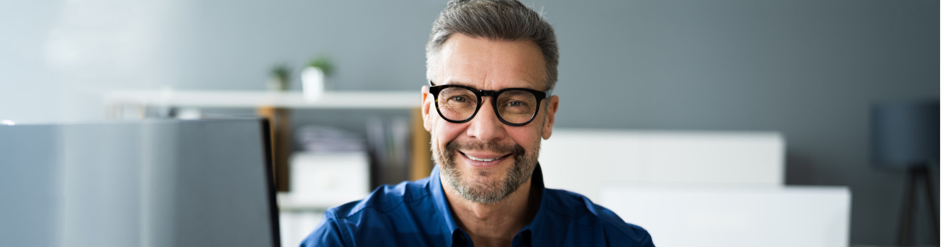 smiling man in office